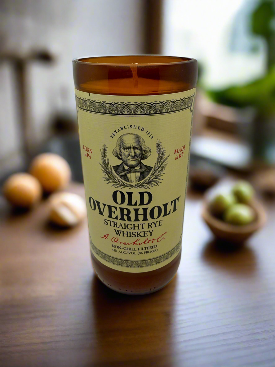 Upcycled whiskey bottle candle with mahogany and teakwood scent in a 20 oz soy wax container, 80-hour burn time.