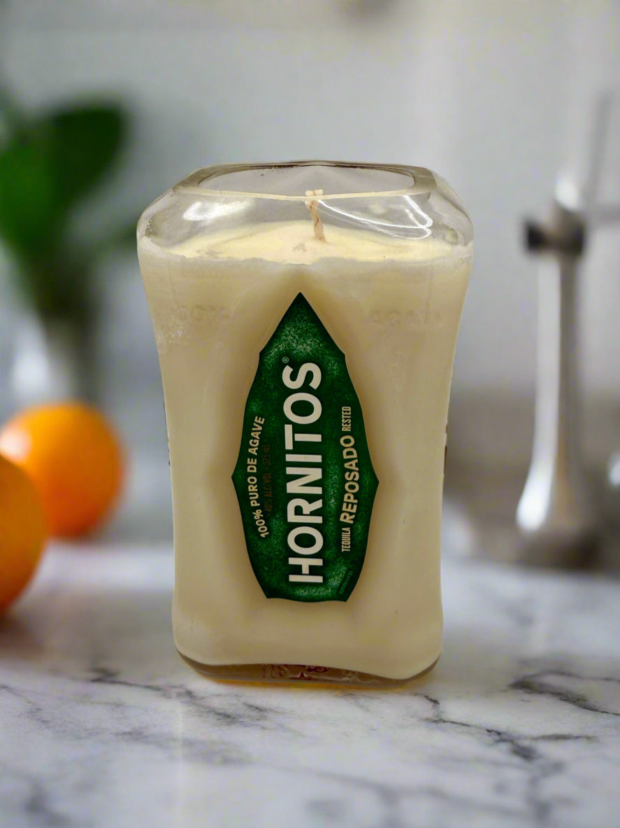 Upcycled tequila bottle candle with citron and mandarin scent, 80-hour burn time, soy wax, rectangular shape