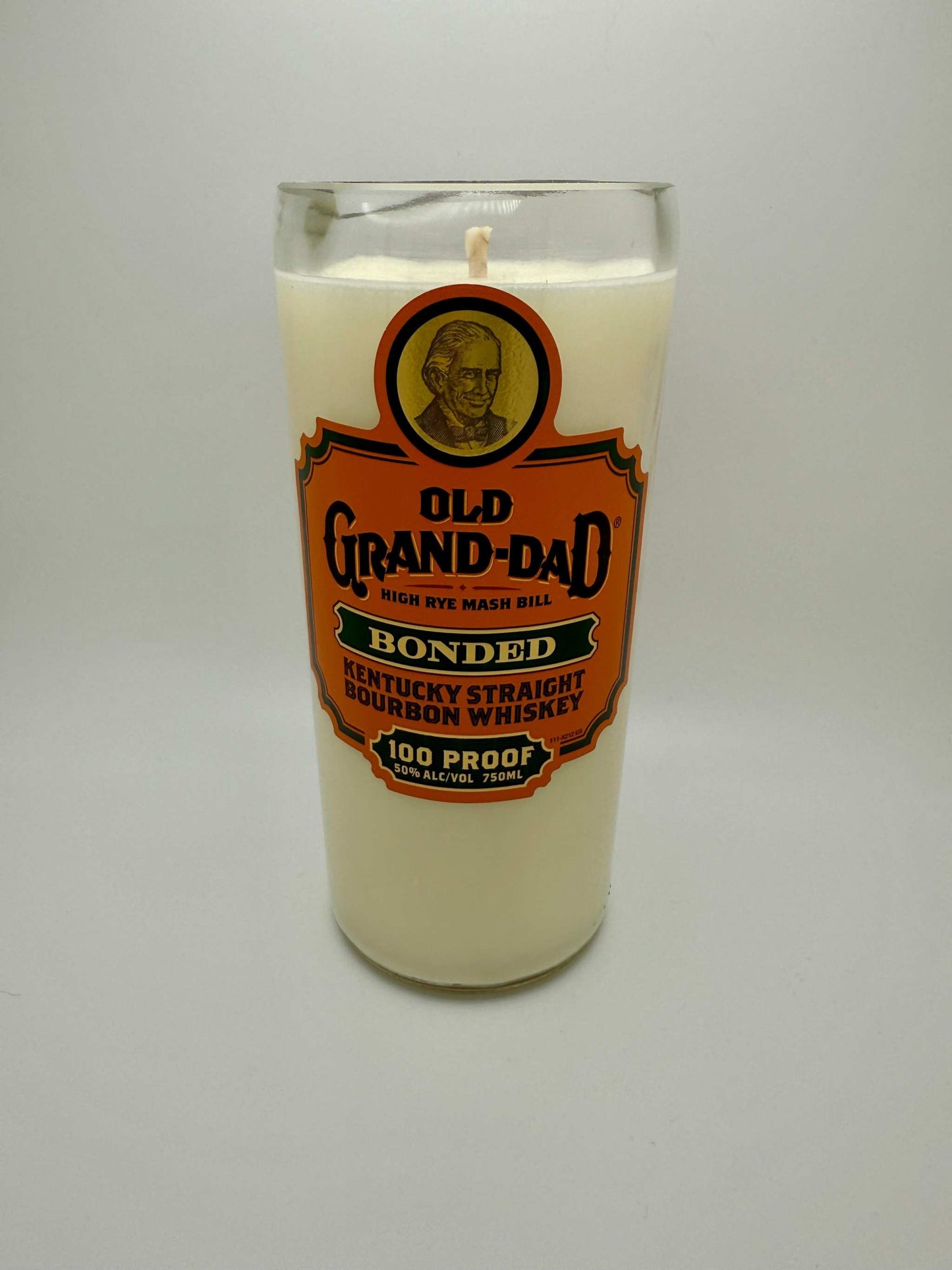 Upcycled whiskey bottle candle in Old Grand-Dad bourbon glass with soy wax and wooden wick