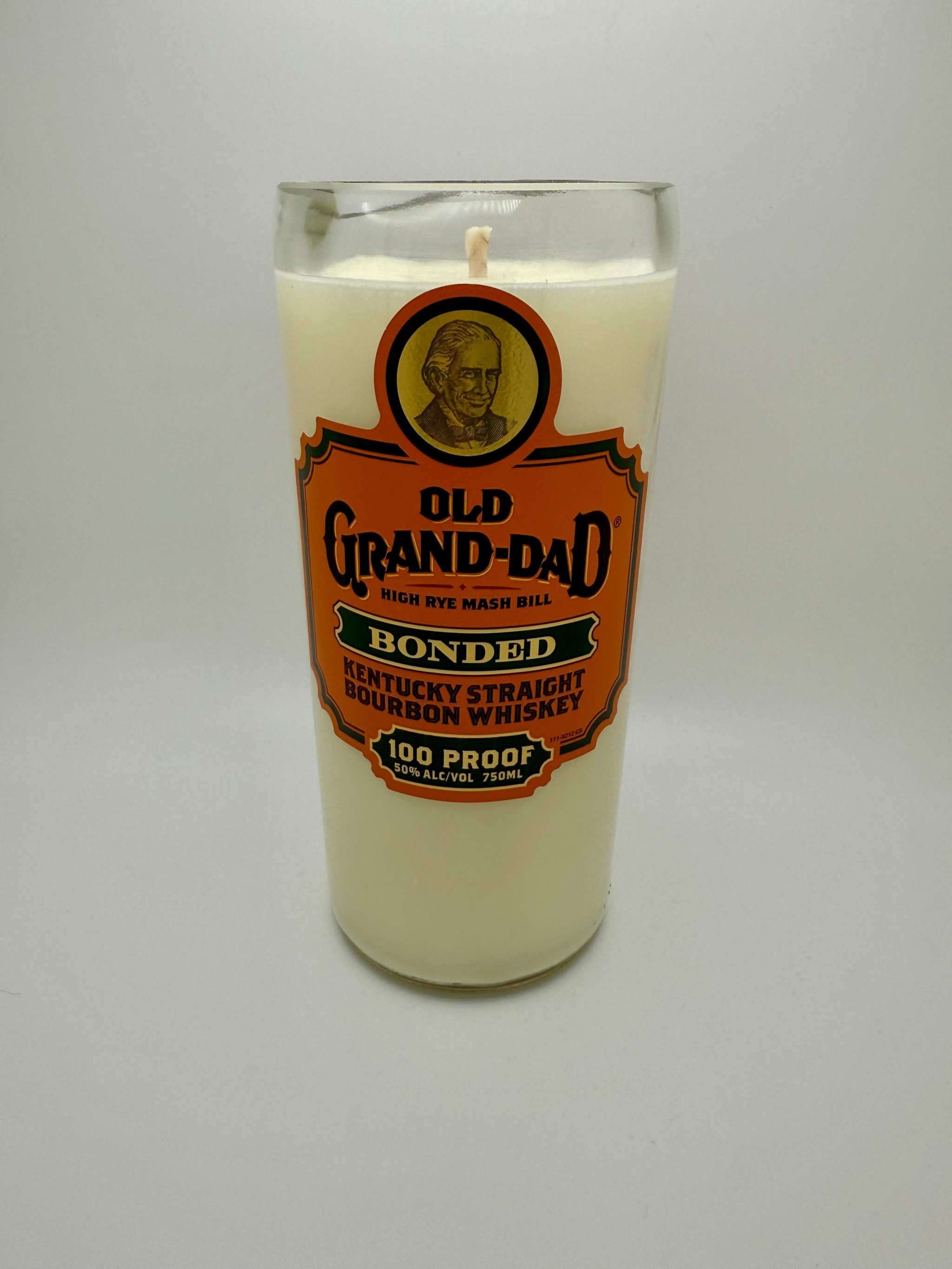 Upcycled whiskey bottle candle in Old Grand-Dad bourbon glass with soy wax and wooden wick