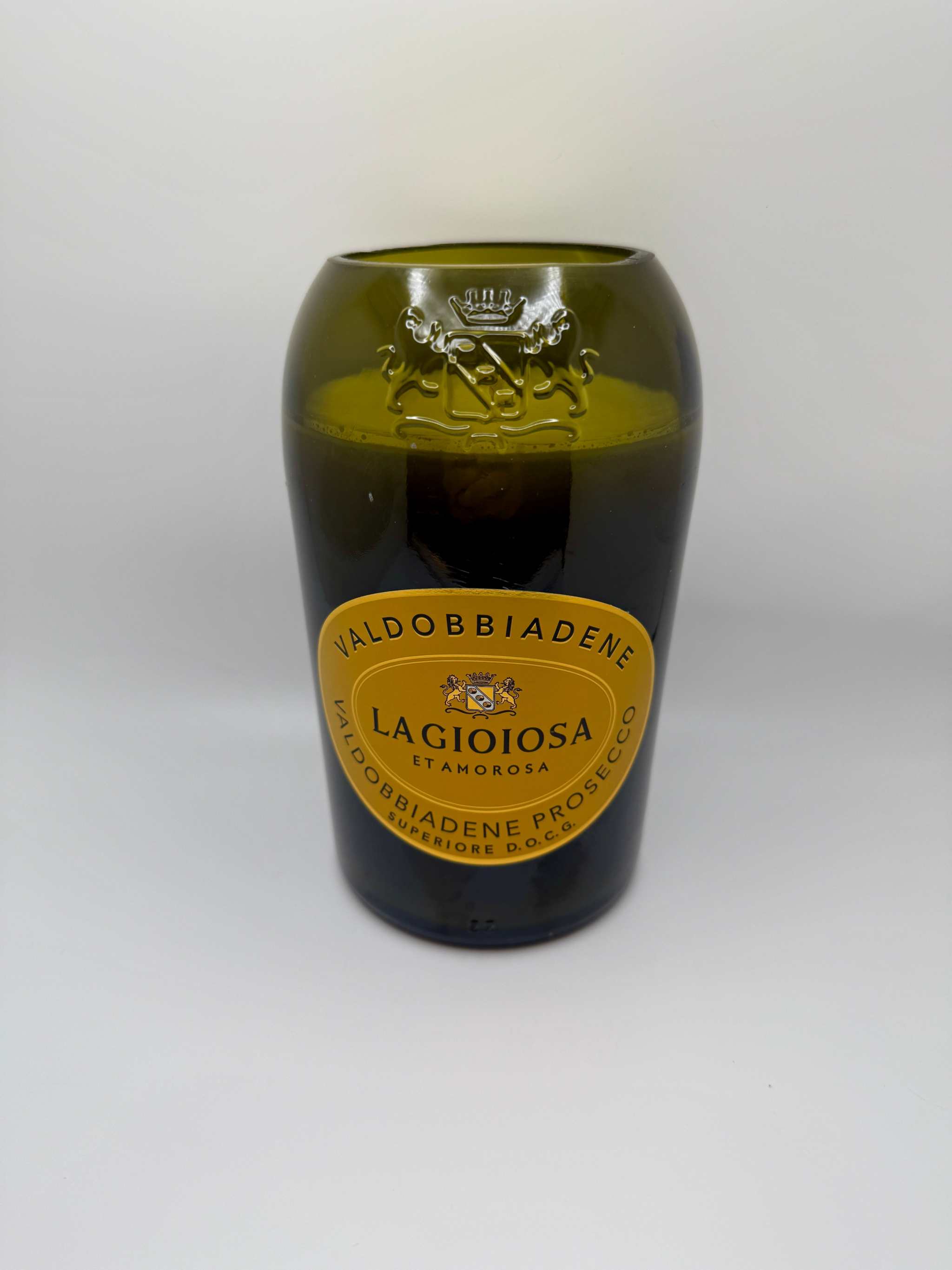 Upcycled wine bottle candle with pineapple sage fragrance in green glass container