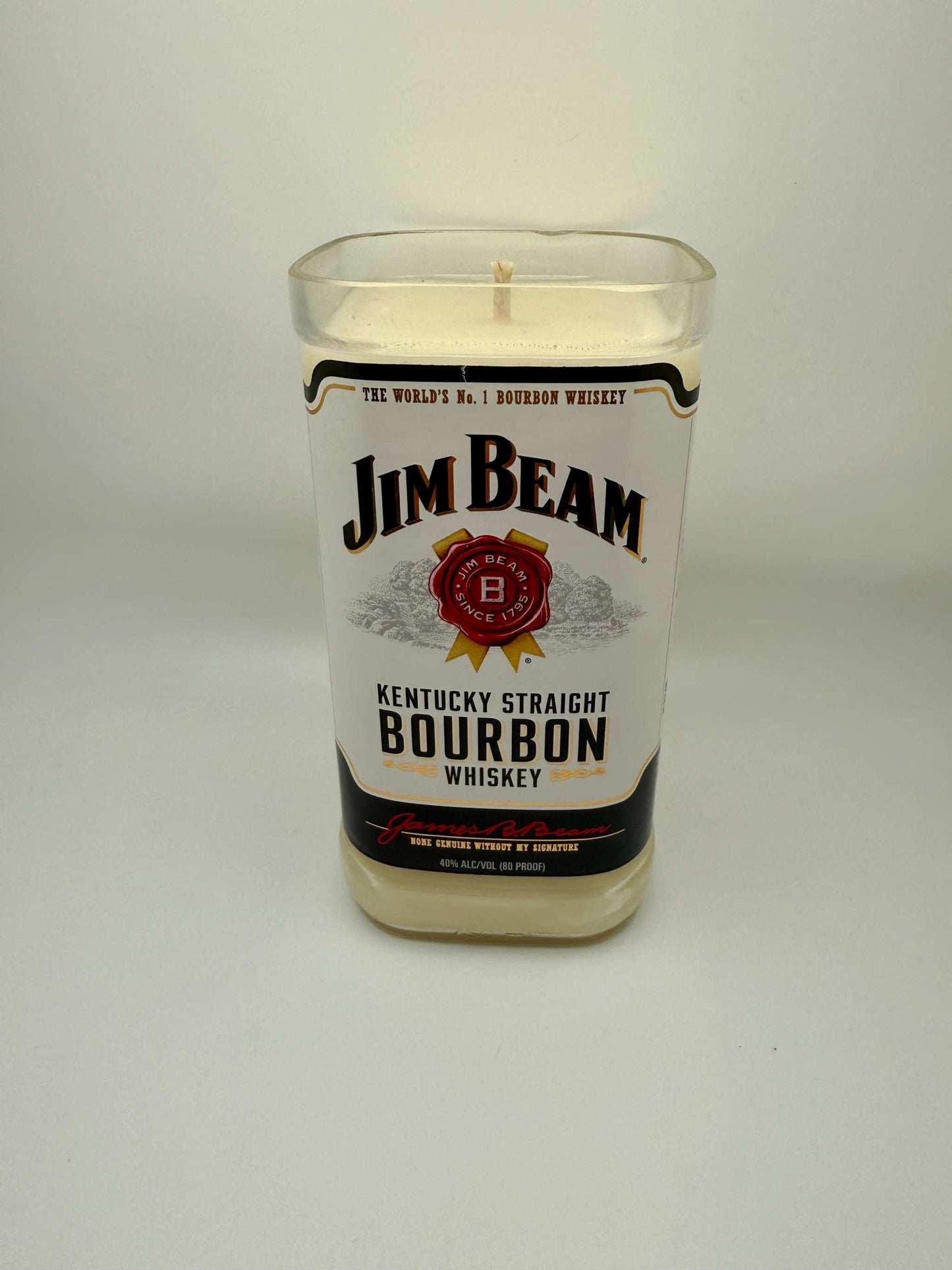 Upcycled whiskey bottle candle with Fred's Cigars fragrance in a Jim Beam bourbon bottle