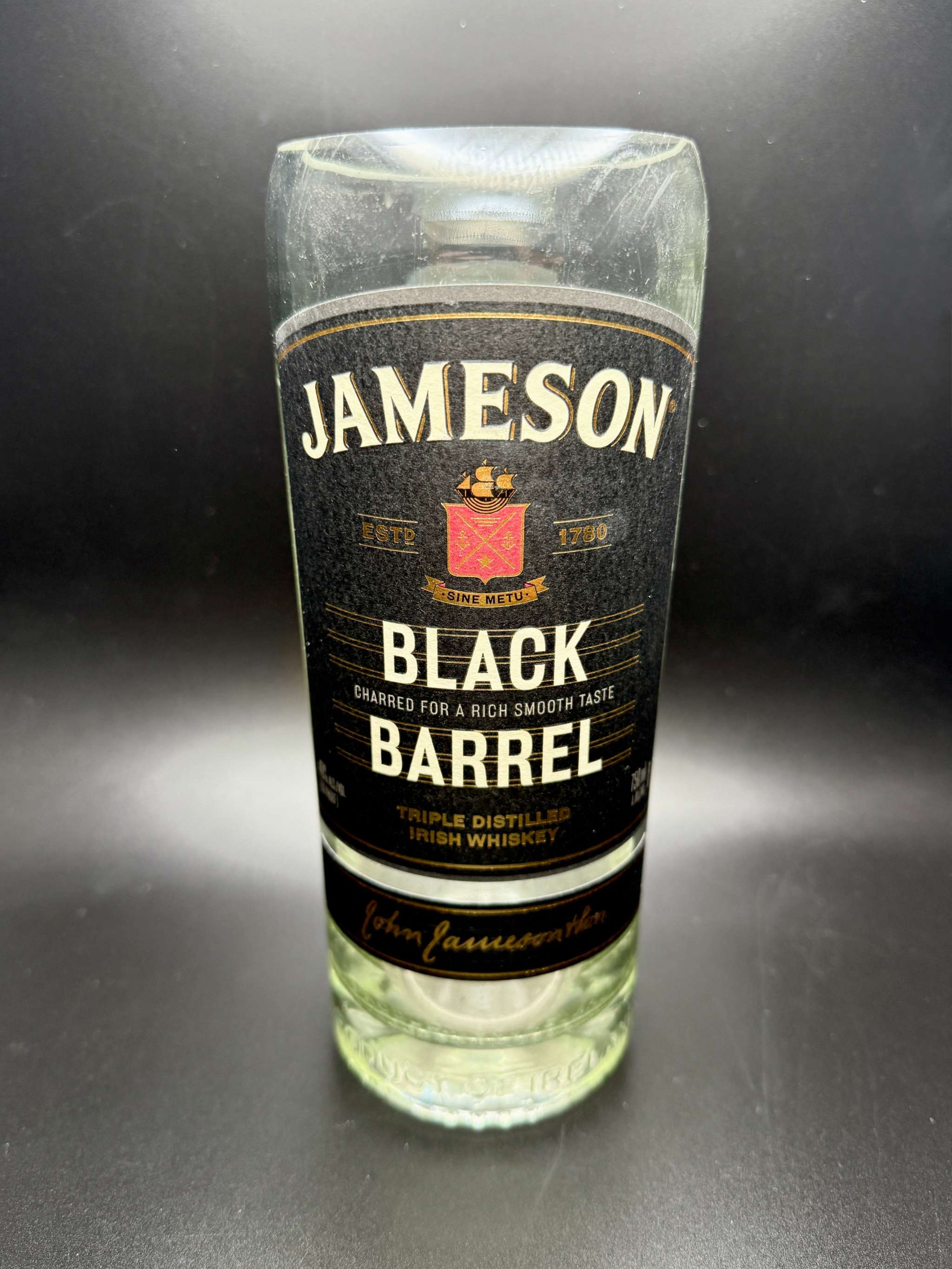 Whiskey Bottle Candle in upcycled Black Barrel whiskey bottle with customizable soy wax and fragrance