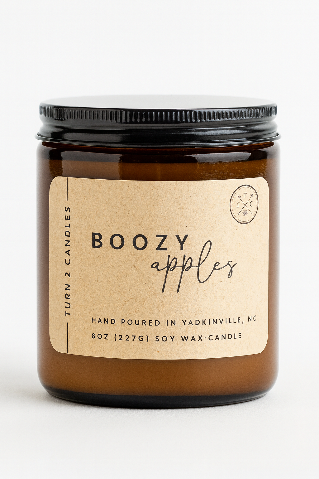 8oz amber jar candle labeled Boozy Apples with hand-poured soy wax in amber glass jar