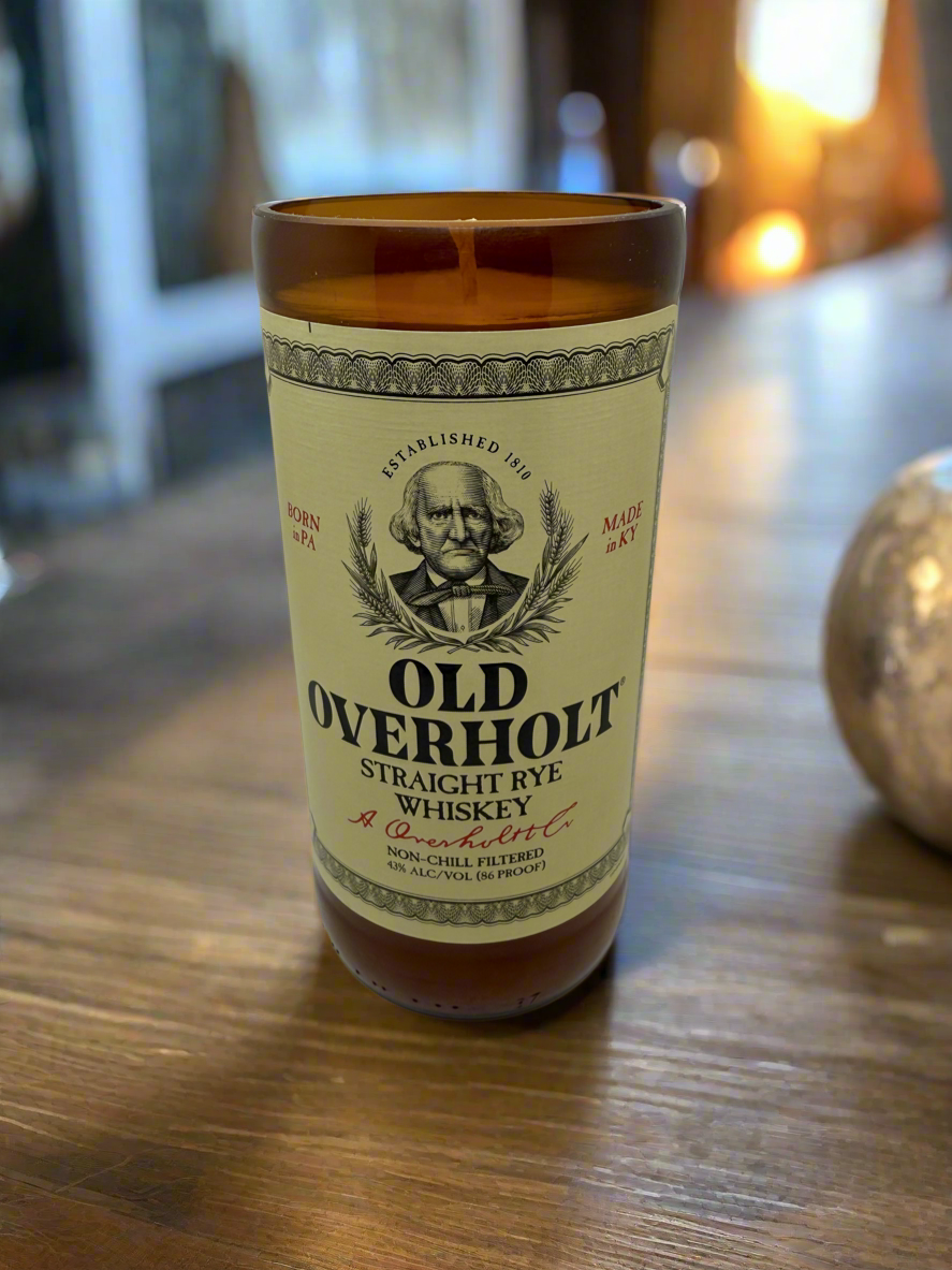 Upcycled whiskey bottle candle with Old Overholt Straight Rye label and amber glass design