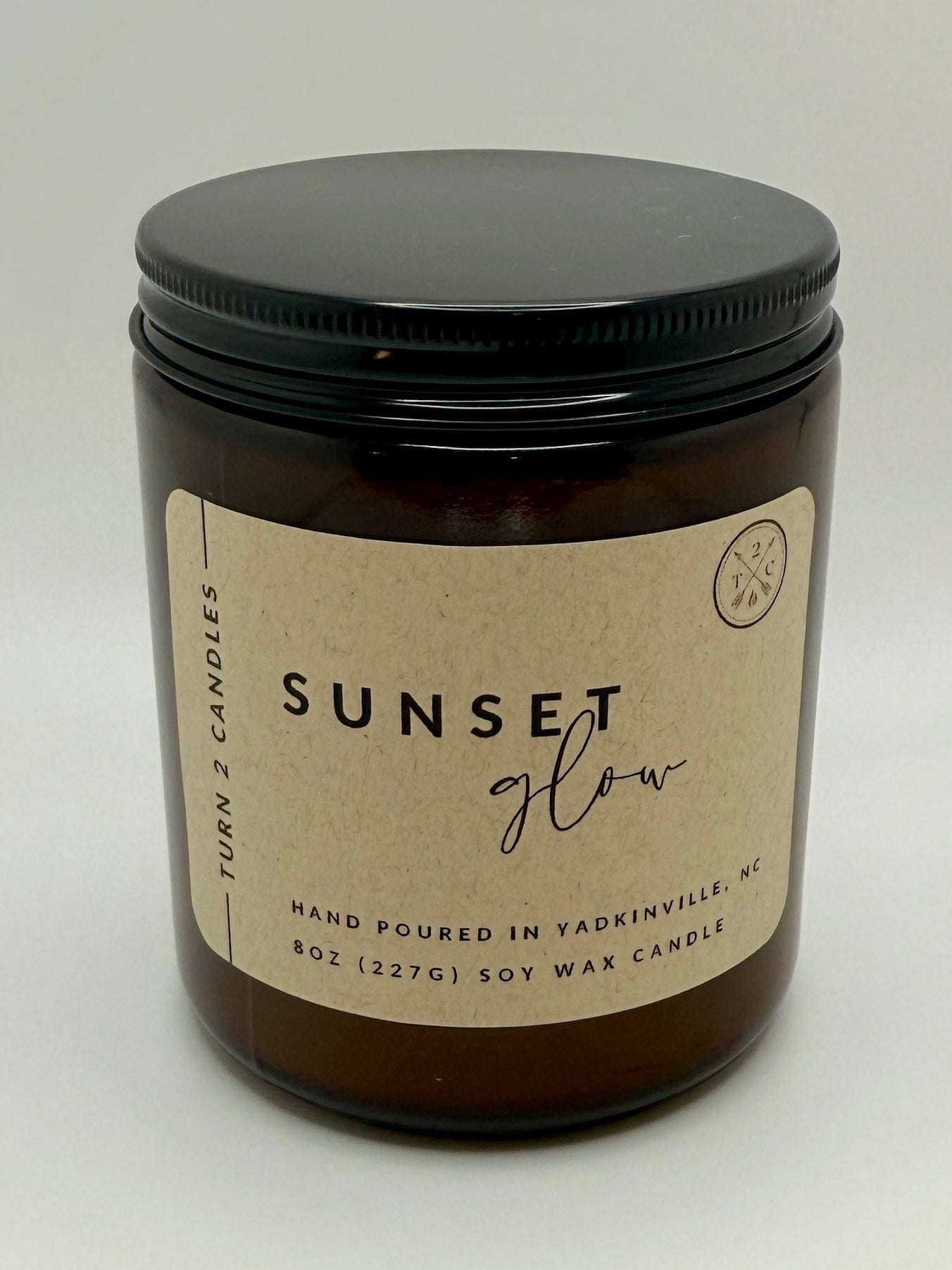8oz Amber Jar Candle with soy wax in amber glass jar labeled Sunset Glow