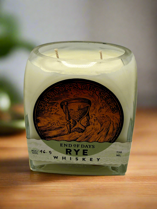 Upcycled whiskey bottle candle with Island Citrus scented soy wax, featuring tropical citrus, pineapples, and subtle driftwood notes.