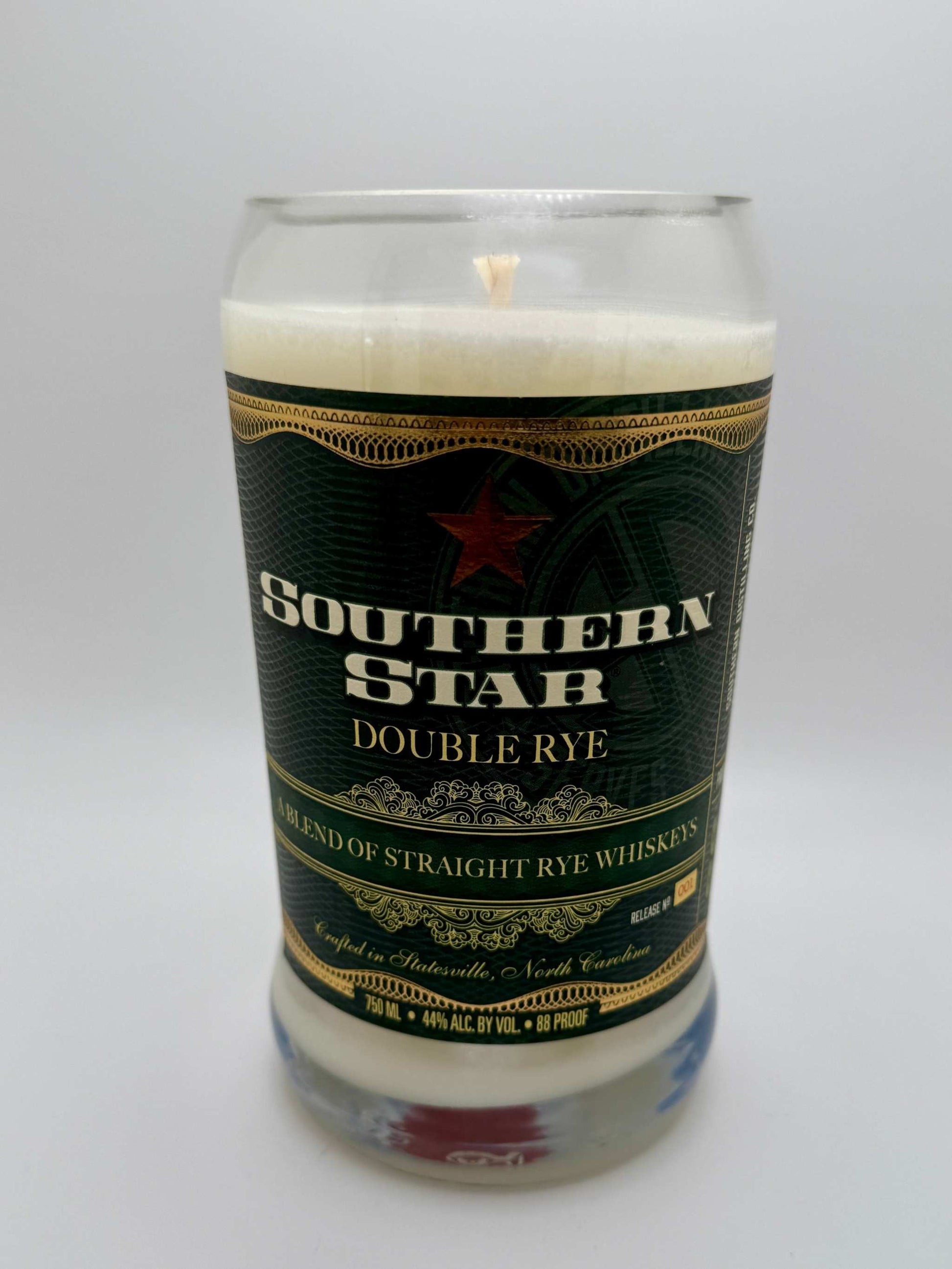 Upcycled whiskey bottle candle with Southern Star Double Rye label, Moroccan cashmere and leather fragrance, 20 oz soy wax, 80-hour burn time