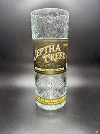 Thumbnail for whiskey bottle candle in an upcycled Jeptha Creed bourbon whiskey bottle with custom soy wax filling
