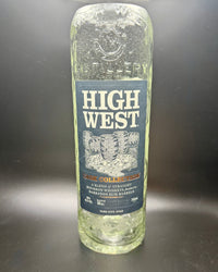 Thumbnail for Clear empty whiskey bottle with High West label used for whiskey bottle candle creation