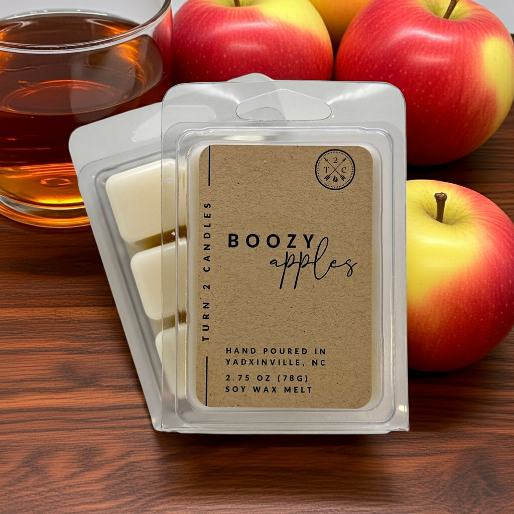 Premium wax melts "Boozy Apples" in eco-friendly soy wax packaging with apples and a cup of tea in the background