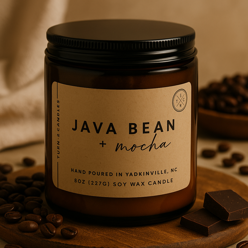 Candle jar labeled 'Java Bean + Mocha' surrounded by coffee beans and chocolate on a wooden surface.